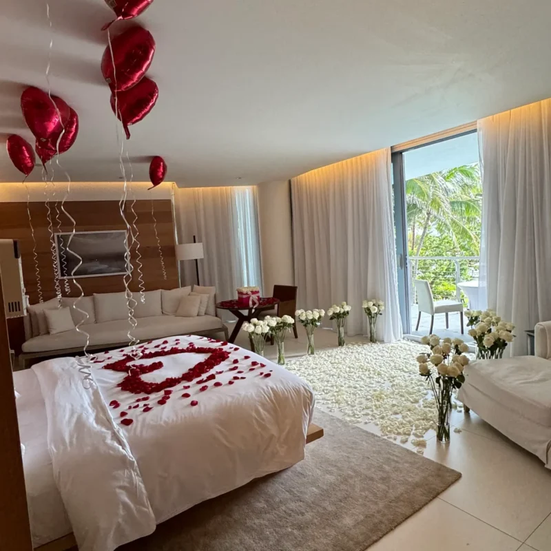 Room makeover with red roses, balloons, white roses